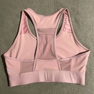 Blush Pink Fabletics sports bra with mesh pocket